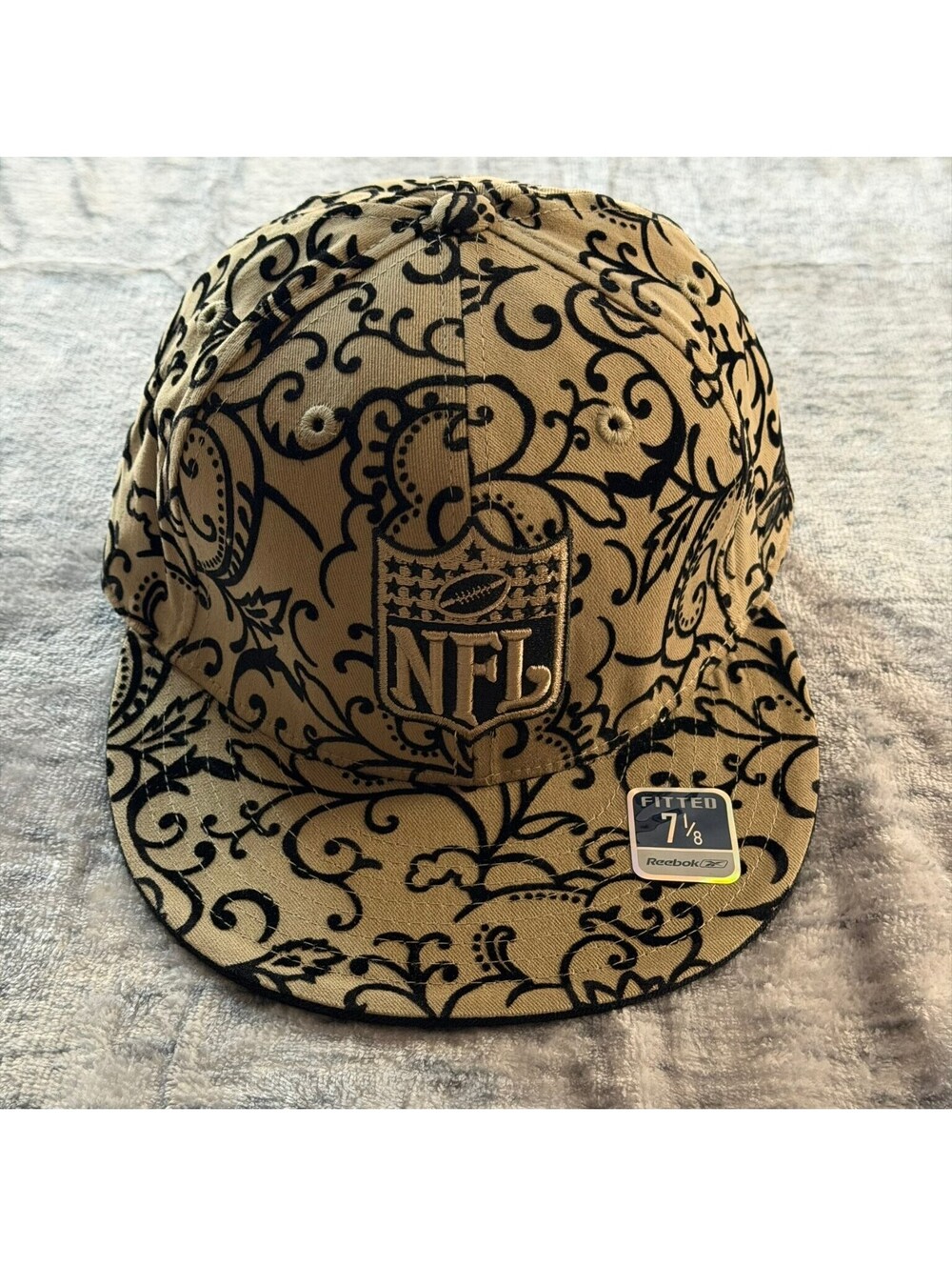 Reebok NFL Fitted Hat Cap 7 1/8 Tan Black Scroll Pattern